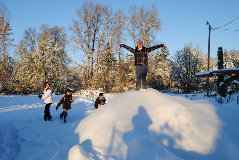 Latia, Mikey, Alex and Shannon on a snow covered pile.
