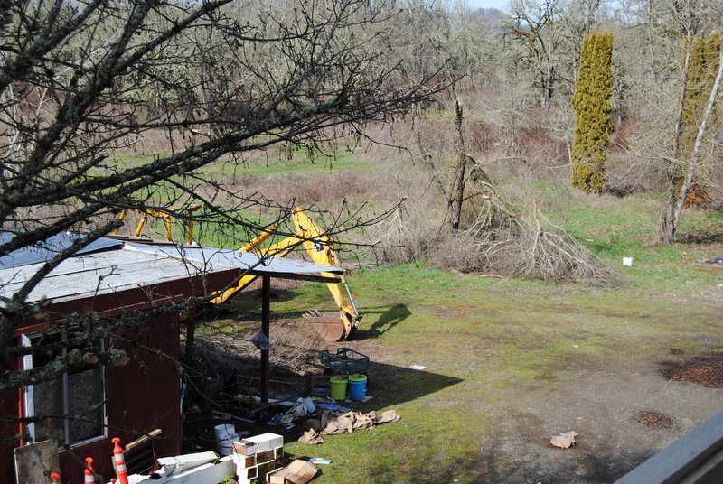 View of Goliath the backhoe and red shed from the balcony of Lois's Loft.