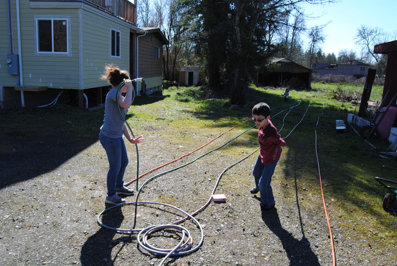 Shannon and Mikey taking care of hoses.