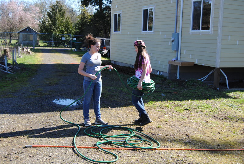 Shannon and Latia winding hoses.