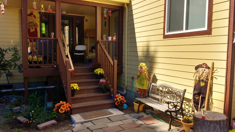 Rosewold's front porch, complete with seasonal decorations including flowers.