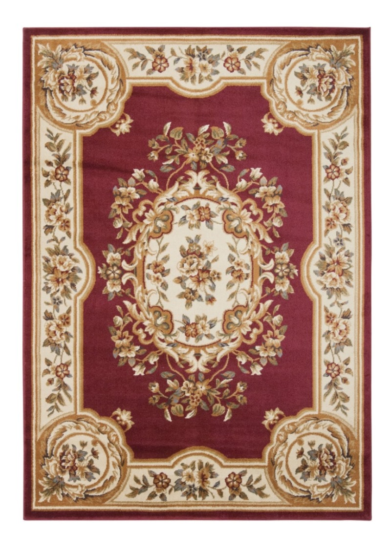 New area rug for the conversation nook in the great room. Don likes the cranberry color and the Persian influence.