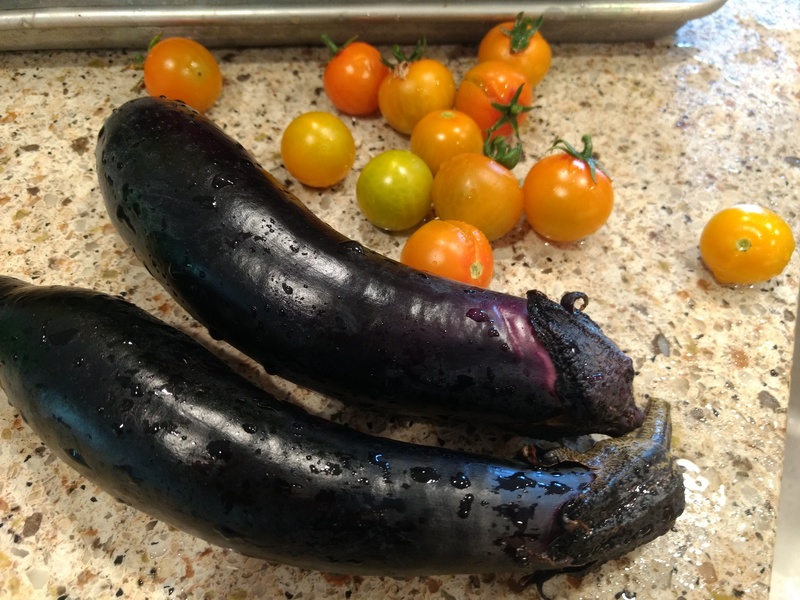 eggplant and cherry tomatoes from our garden. I think the tomatoes are sweet 100. I have another kind I don't like, and I am not sure if they will be good in cooking or what.