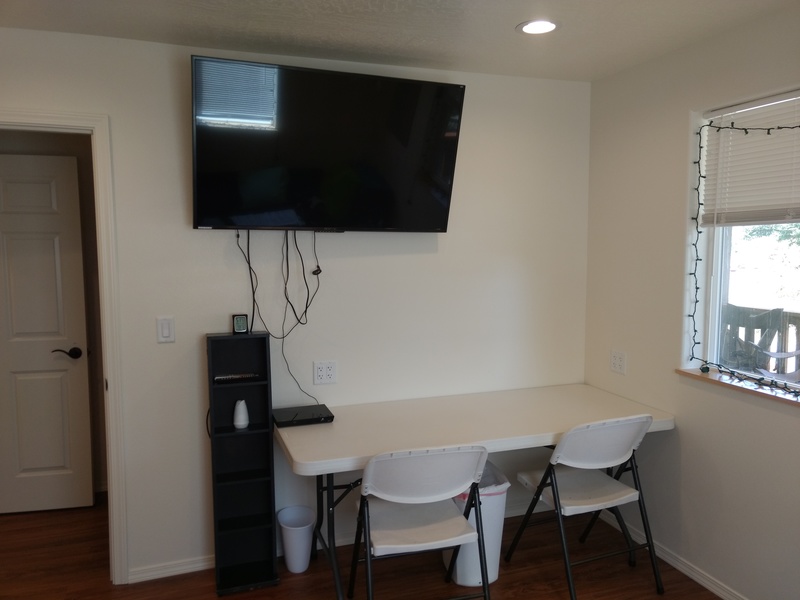 rm1 (the Gamers Room) has a 55-inch TV on the west wall, with a table for gaming consoles.