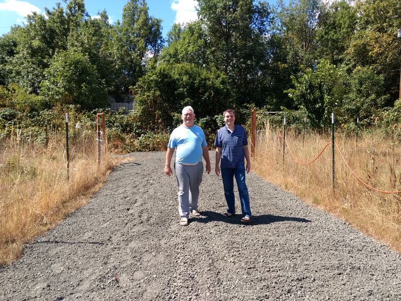 Don and Joseph enjoy the broad new roadway on Cherry that Lois had built.