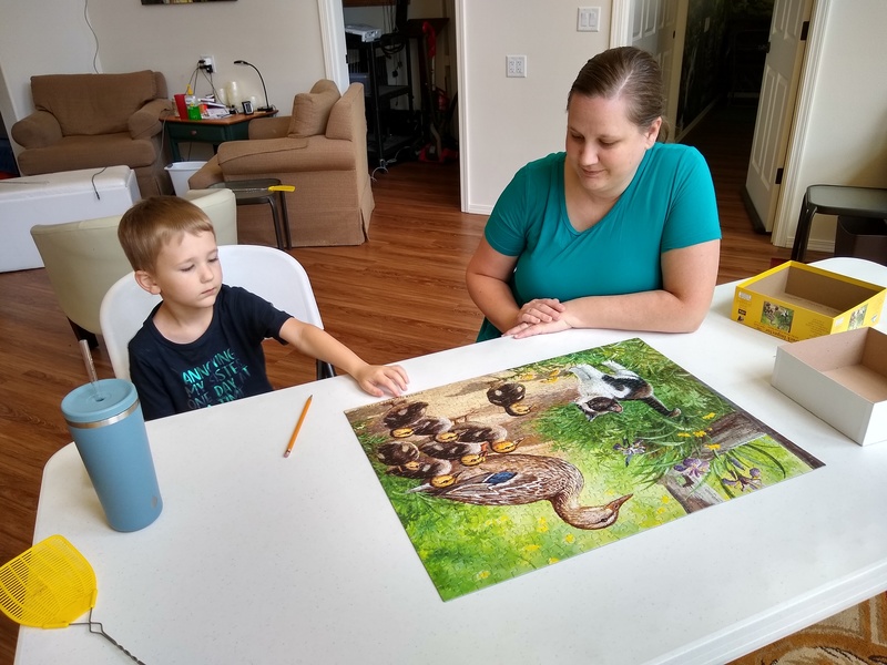 Family Gathering: Austin and Stacia work on a picture puzzle.