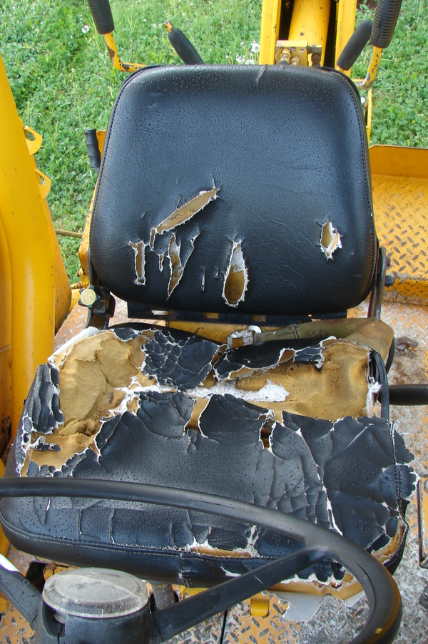 Goliath the backhoe's beat-up seat.