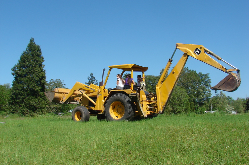 Taking the kids for a ride on Goliath the backhoe.