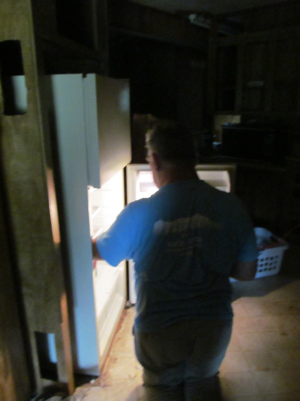 Don: inspecting new refrigerator. Does it actually work? Hard to tell.