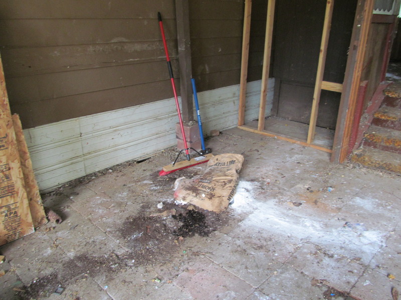 Here is where the shed was. There's a bag of lime that split open and I left it. Carport.
