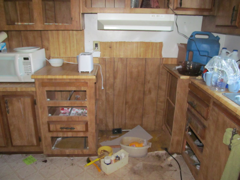 Microwave, drawers and stove area.