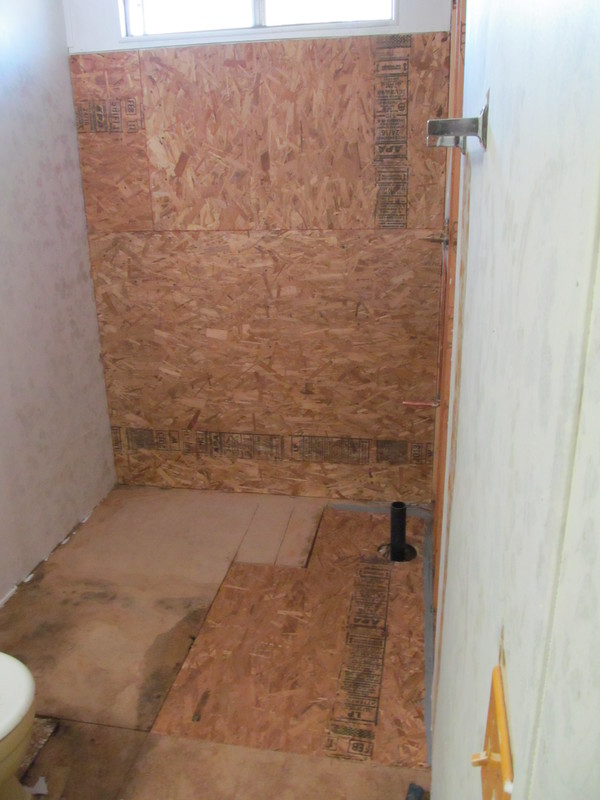 Shower progress. Bathroom repairs, ready for the shower to be installed.