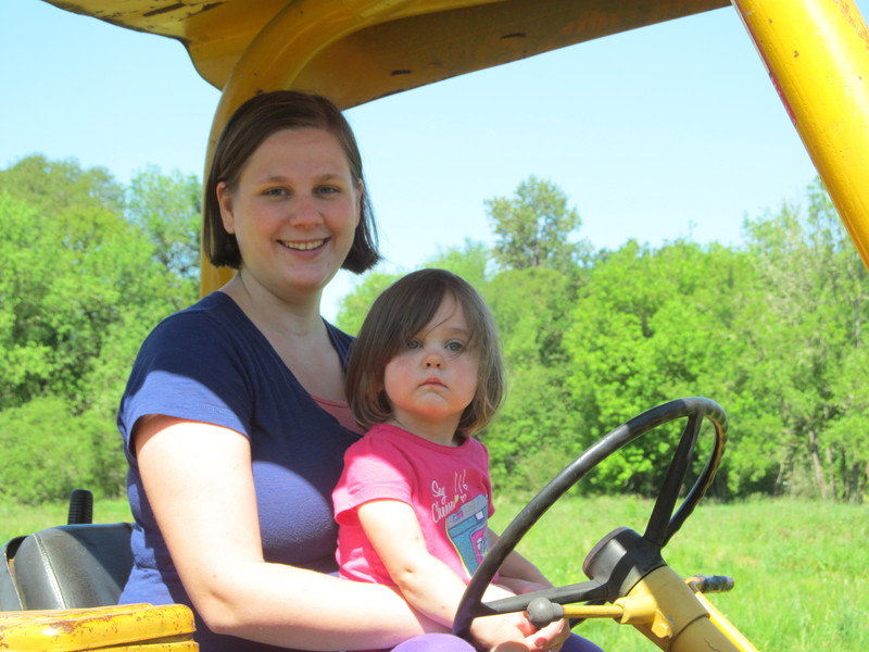 Emily driving Goliath the backhoe. (Not really)