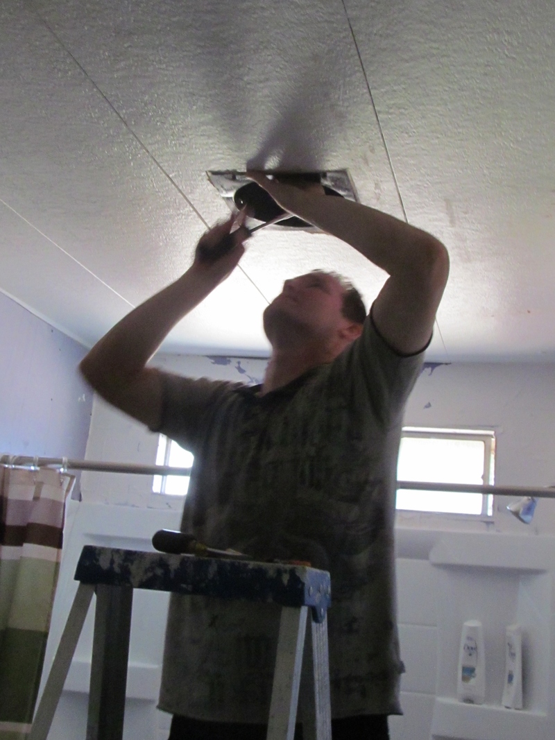 Chuck installs hall bathroom ceiling fan.