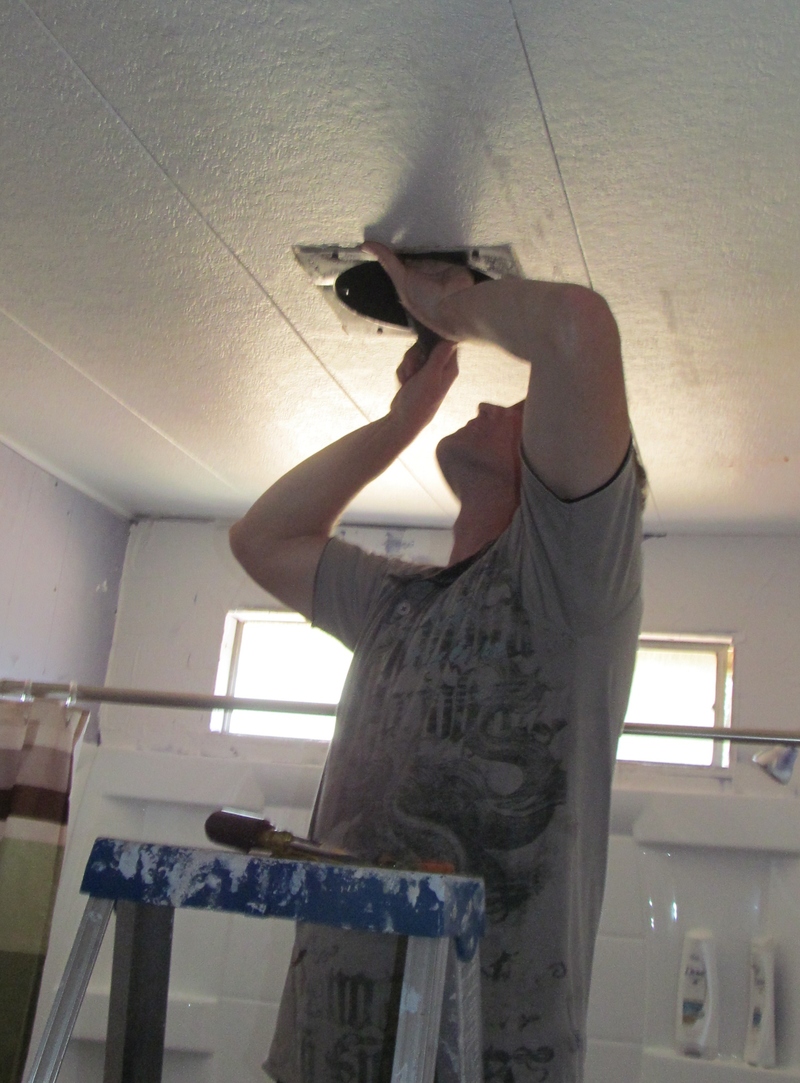 Chuck installs hall bathroom ceiling fan.