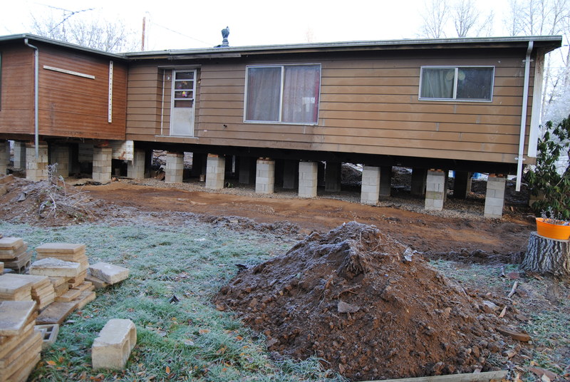 The southeast side of the house.  The whole porch area has been cleared.