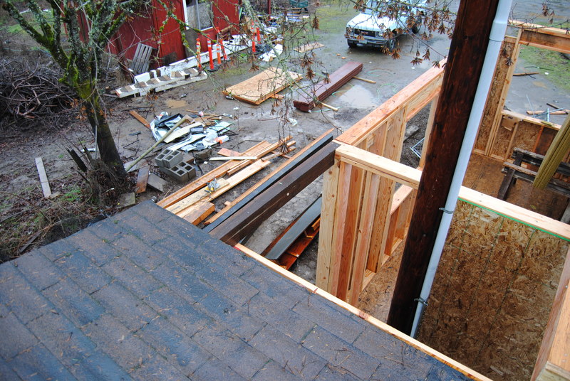 Looking down into the stairwell that currently has a power pole in it.