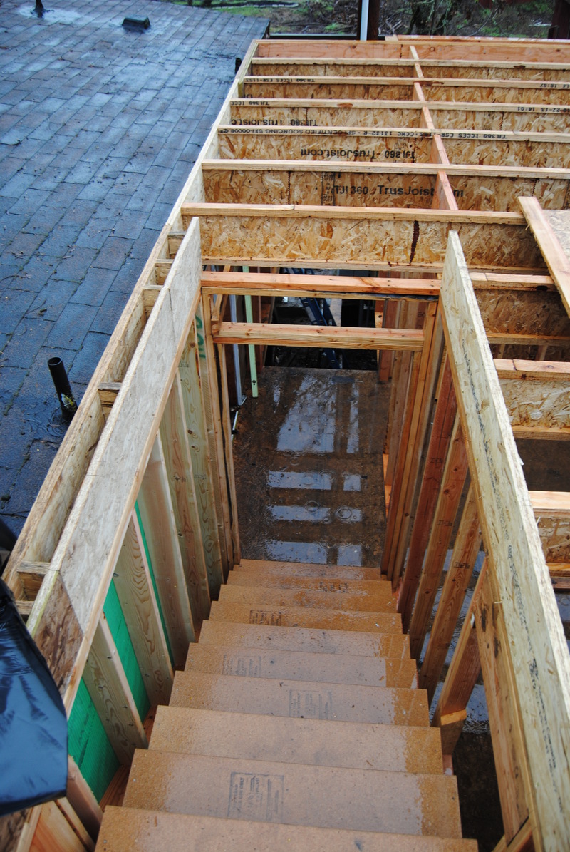 Looking down the stairs from Lois's Loft. Lots of water on the floor. Nice puddles.