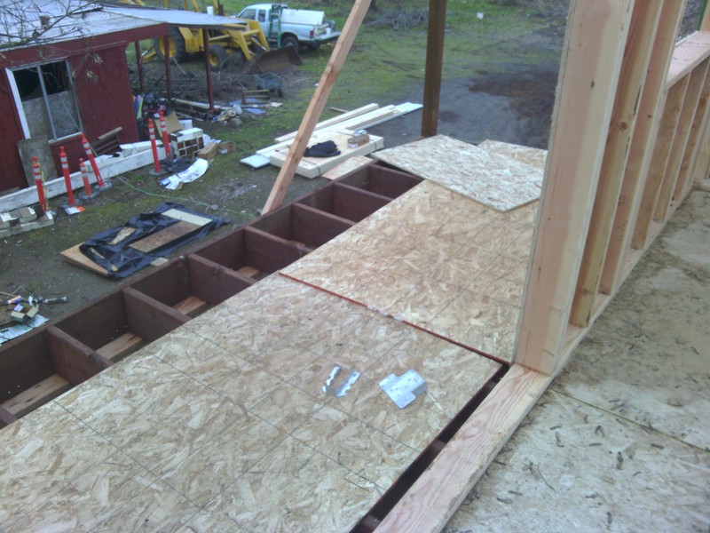 View of Lois's balcony. Some plywood is down for walking on.