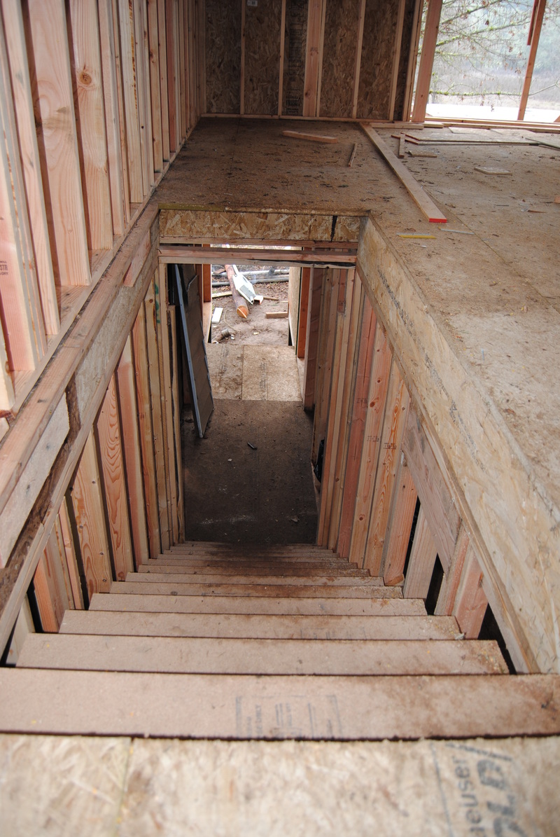 View down Lois's stairway. The west landing is new. Above that is Lois's powder (half bath) space.