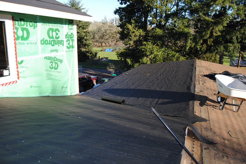 View of the east half of the north half of the old cottage roof. Felt is in place throughout.