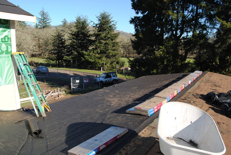 View of north roof from south roof. Shingles have arrived.
