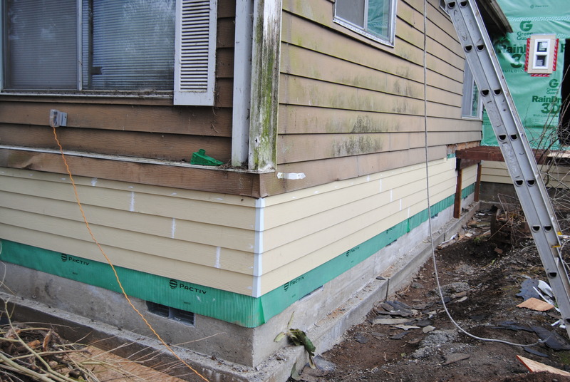 Siding has been added to the bottom several feet of the old house. Here we see the northeast corner of the old house.