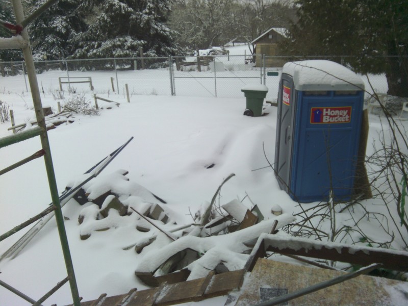 View east from Don's study door. The water lines are frozen and have been for two days. That means the toilets do not have water to flush. It's handy that the construction people brought in a Honey Bucket porta potty.