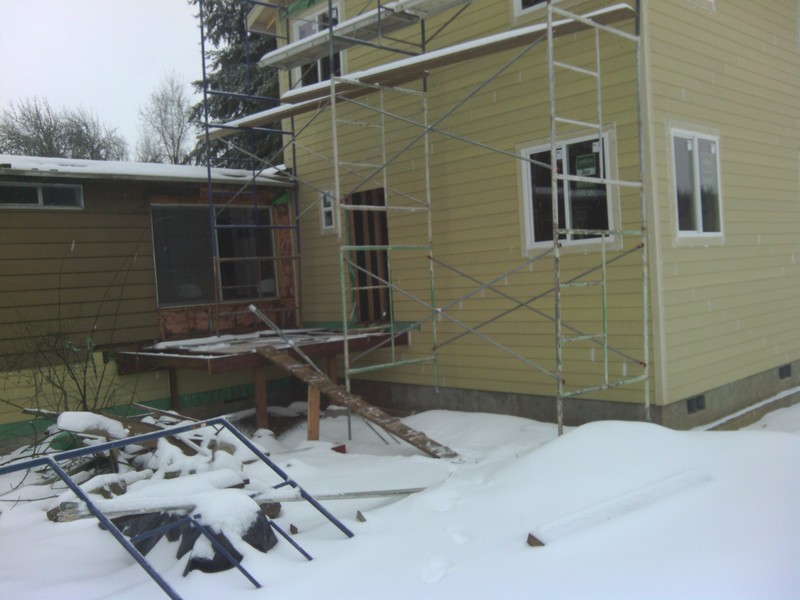 View of the east face of the addition. The front porch has been expanded by about three feet.