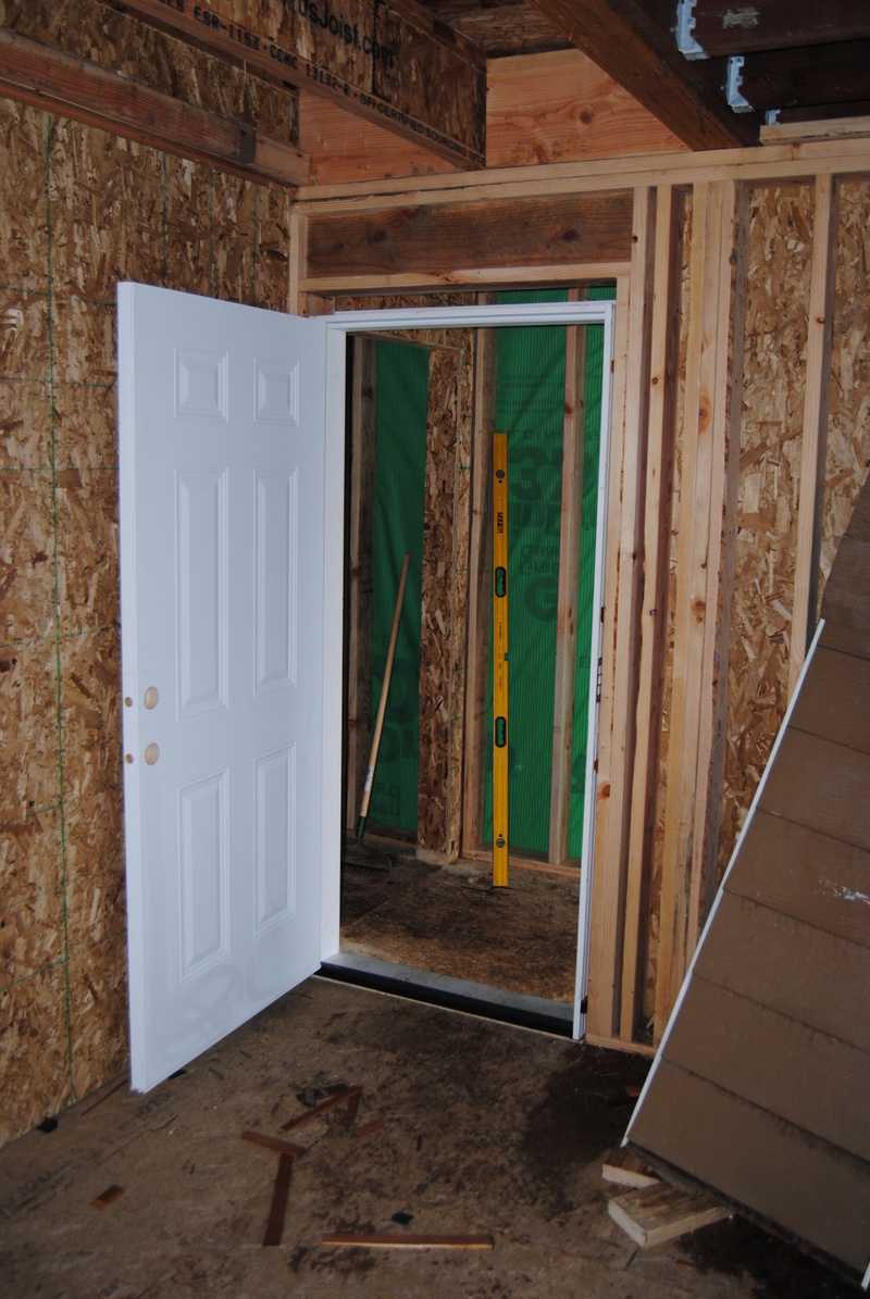 A new door for Don's workroom. It opens onto the landing at the top of the west stairway.