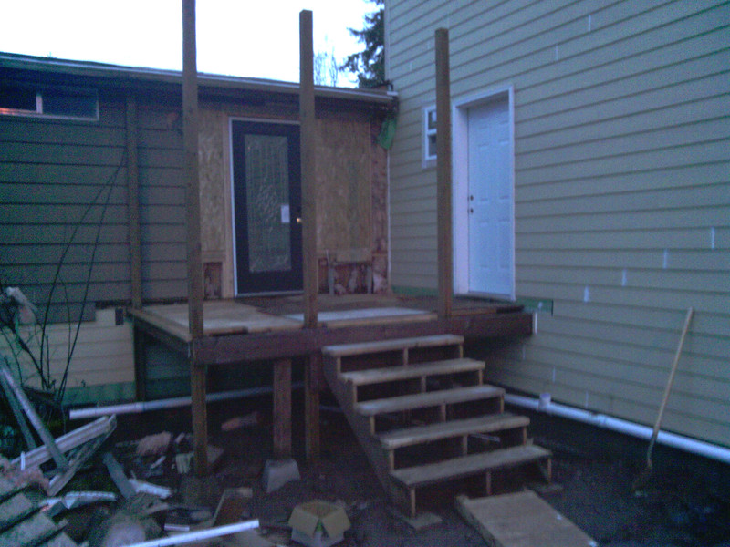 Steps to the front porch. View of front door and study door.