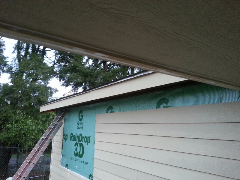 View of the highest row of hardiplank installed, and the completion of the fascia.