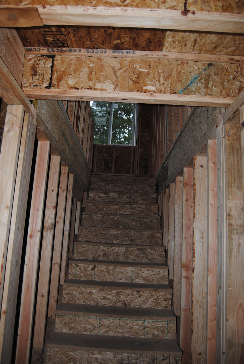 Steps up to Lois's Loft. Looking east from the bottom of the stairs. There should be a doorway framed in, but maybe that comes later.