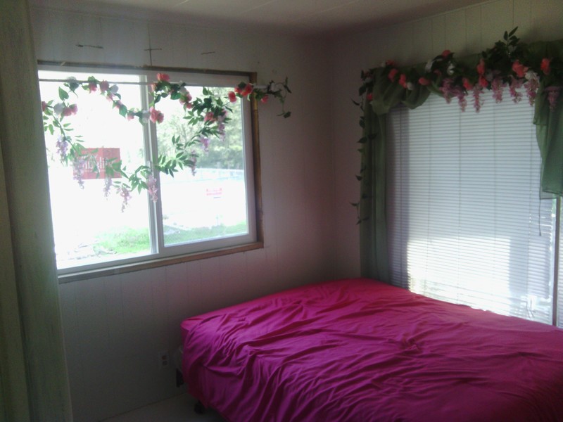 Rose Room, new window in the north wall. Bed pushed up against the east wall.