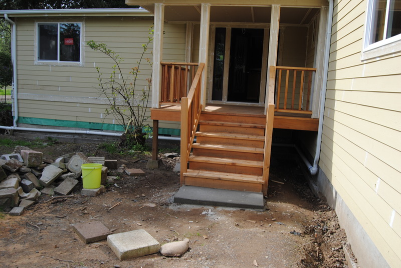 Front steps with cement landing.