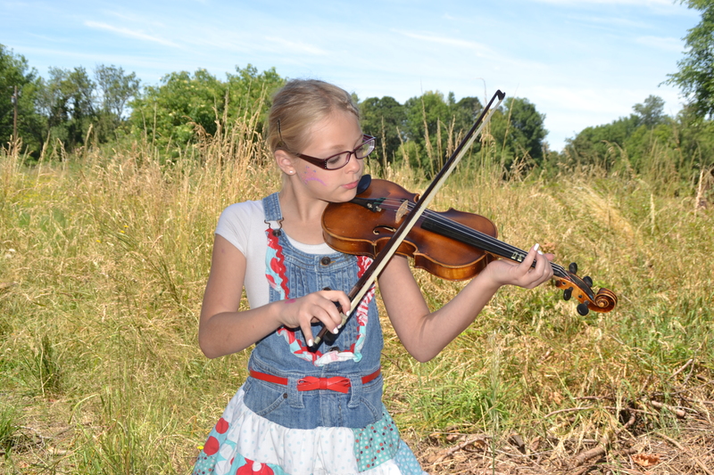 Briyanna and the violin in the fields of Rosewold.