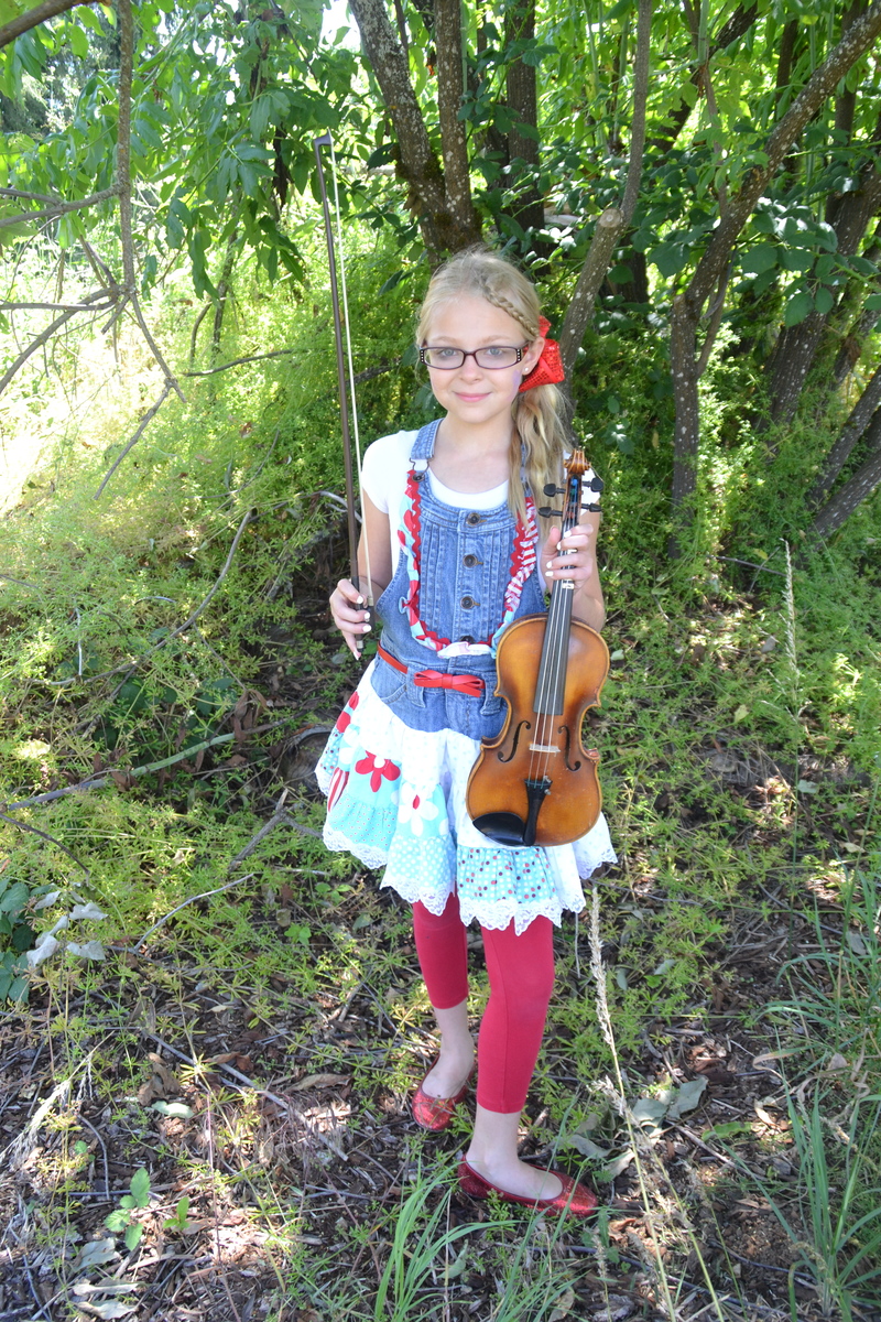 Briyanna and the violin in the fields of Rosewold. Ruby slippers too.