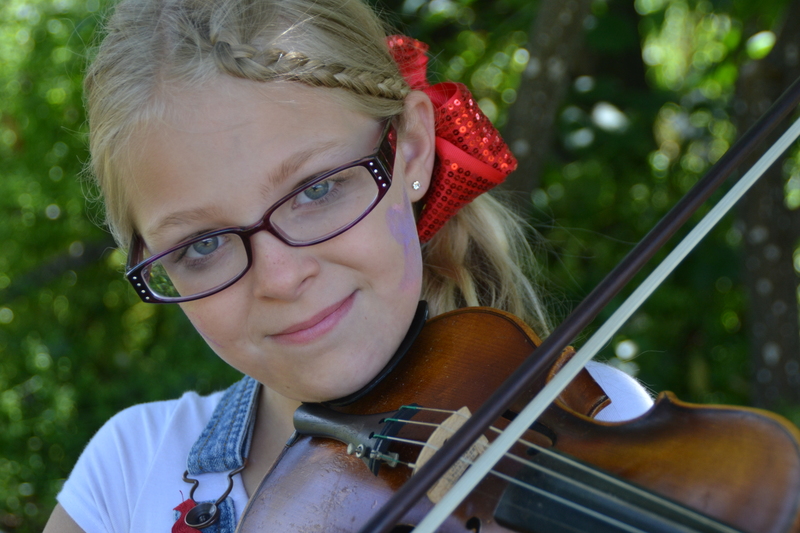 Briyanna and the violin in the fields of Rosewold.