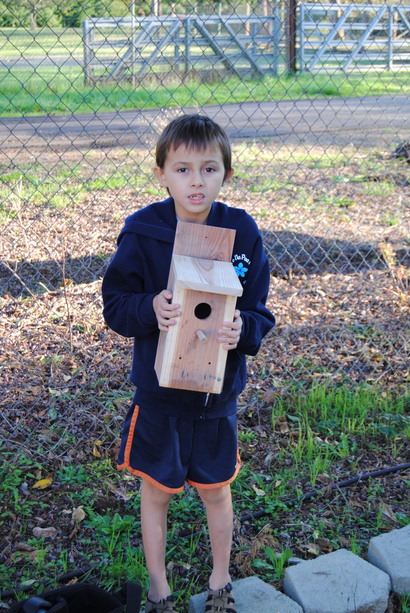 Alex with Bird house, ready to be installed.