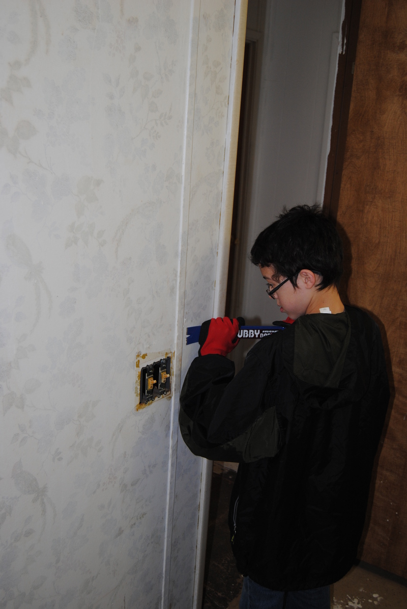 Mikey getting ready to remove wall panels.