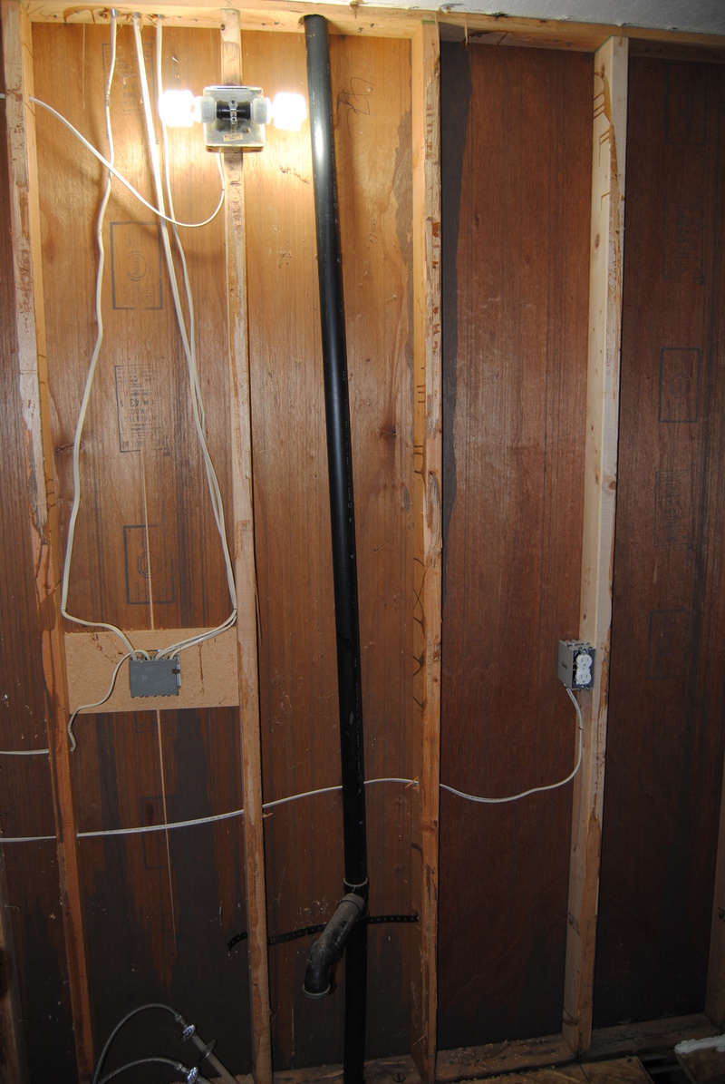 West wall of the main bathroom with a new outlet.
