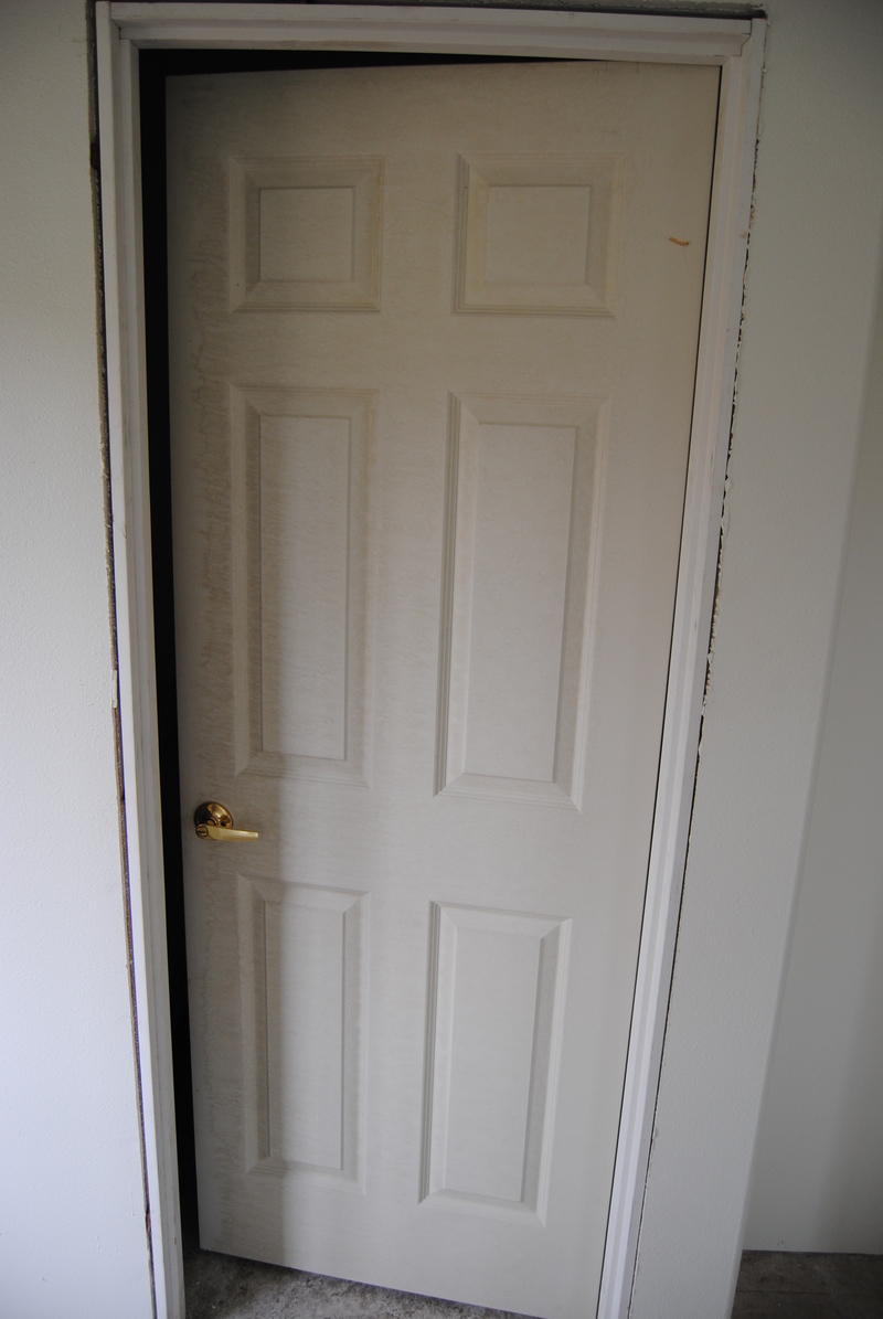 Don's bathroom door. Notice the discoloration. Water damage possibly caused by being stored outside.