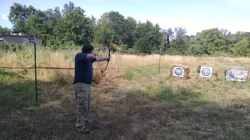 Chris Bevans is trying out the archery range.