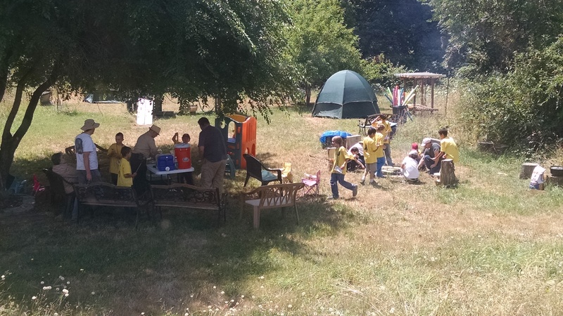Scouts in the picnic area, preparing lunch.