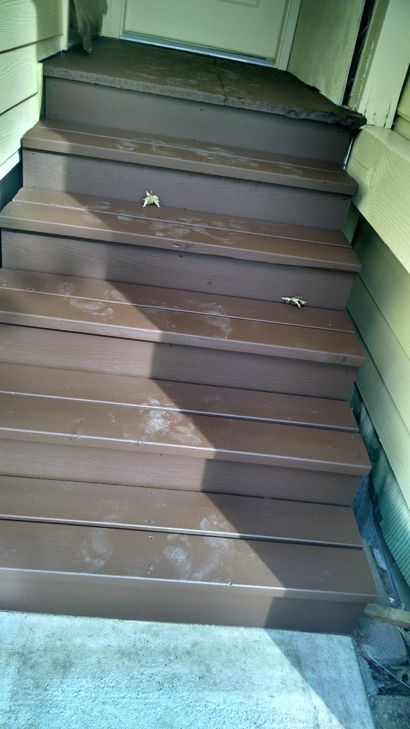 west entryway stairs with footprints