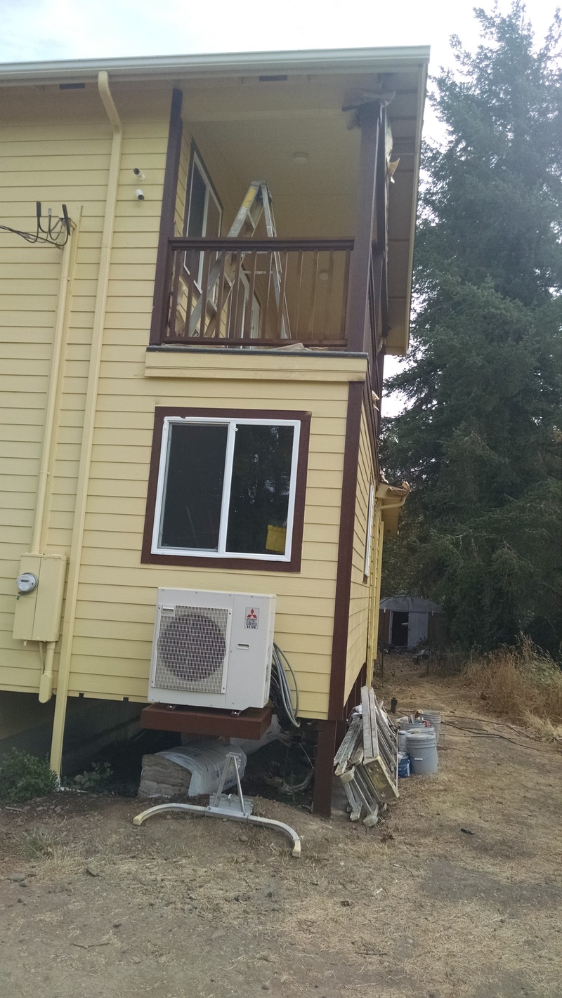north side of the house, hvac external unit and Lois's balcony.