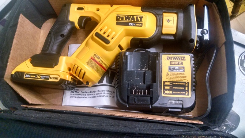 Lois's new toy: A DeWALT Sawzall. It came in handy for several steps of the window removal and shelf sizing.