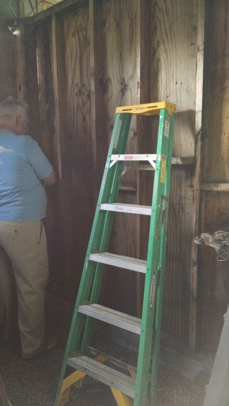 Don is prepping a wall in the Red Shed to create a wall of tools for Lois. Then he can have his storage room not have the "Yard and Garden" tools and supplies in it.