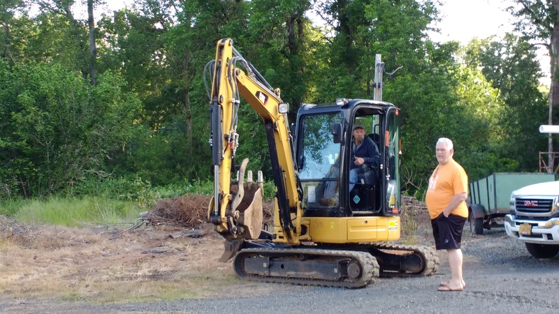 Here is Don with Jeff Bowers, the owner of Royal Flush, sitting in his excavator.