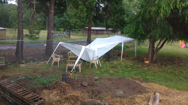 Don, Lois, and Isaac moved the party tent for the reunion so we could see the playground. Then the wind challenged us, but we repaired it. Then the combo wind and rain took it down. The side poles were strong enough, but the top was not.